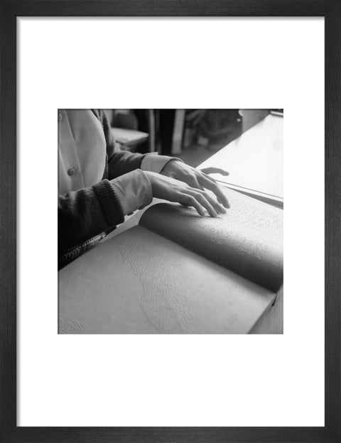 Close up of hands of child reading Braille at the Linden Lodge School for the Blind.