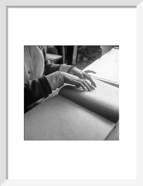 Close up of hands of child reading Braille at the Linden Lodge School for the Blind.