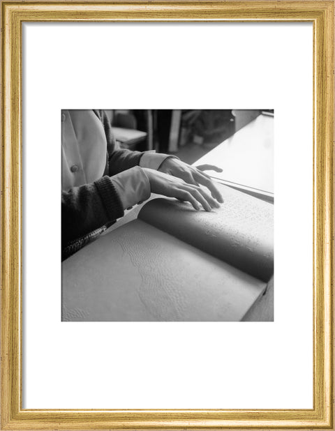 Close up of hands of child reading Braille at the Linden Lodge School for the Blind.