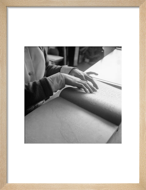 Close up of hands of child reading Braille at the Linden Lodge School for the Blind.