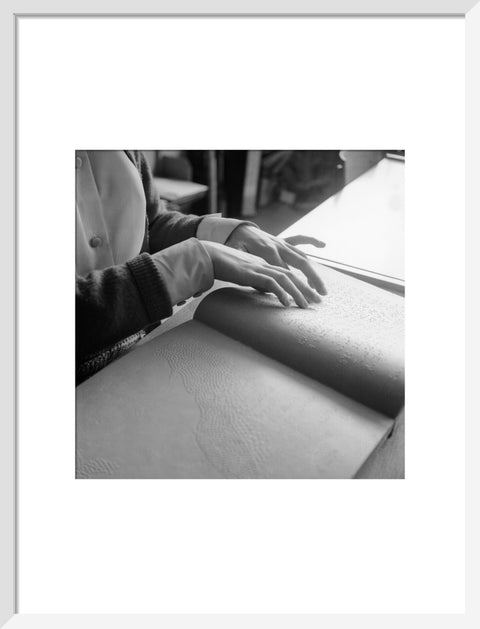 Close up of hands of child reading Braille at the Linden Lodge School for the Blind.