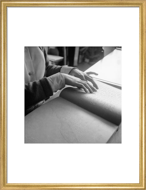Close up of hands of child reading Braille at the Linden Lodge School for the Blind.
