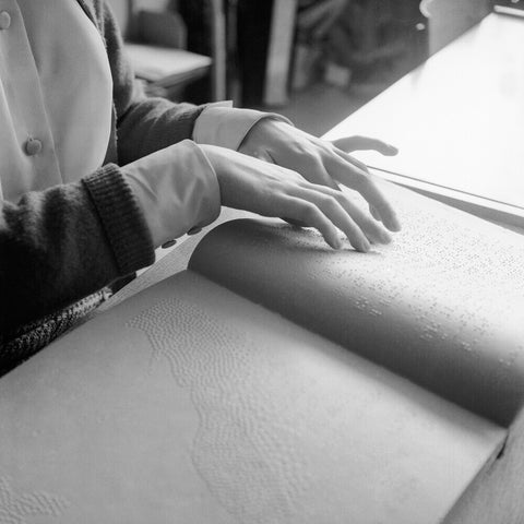Close up of hands of child reading Braille at the Linden Lodge School for the Blind.