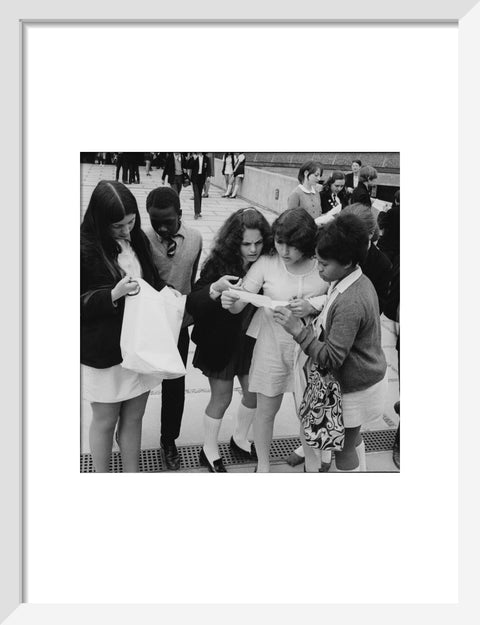 School girls receiving school reports or exam results