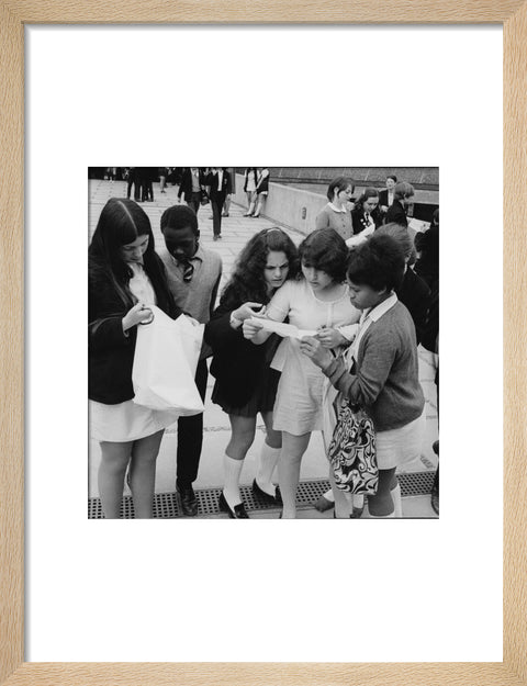 School girls receiving school reports or exam results