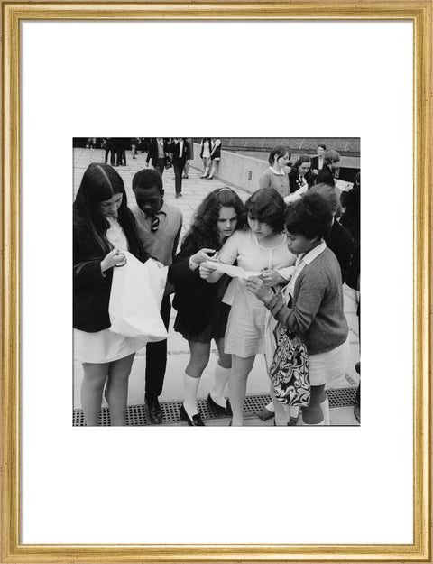 School girls receiving school reports or exam results