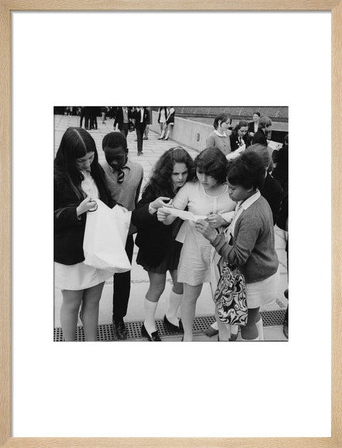 School girls receiving school reports or exam results
