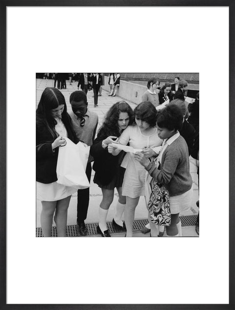 School girls receiving school reports or exam results