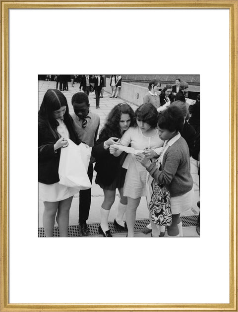 School girls receiving school reports or exam results