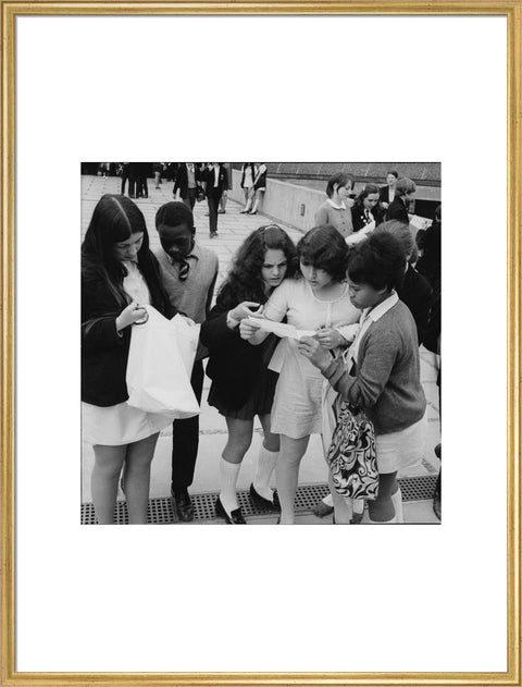 School girls receiving school reports or exam results