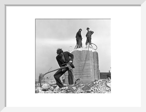 Three men working on a building site.