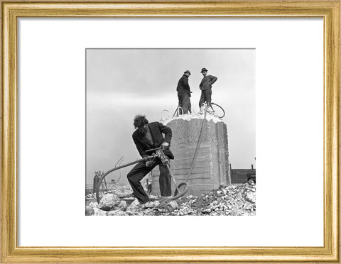 Three men working on a building site.
