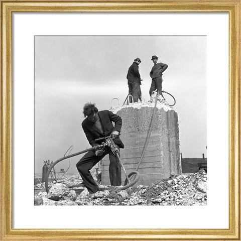Three men working on a building site.
