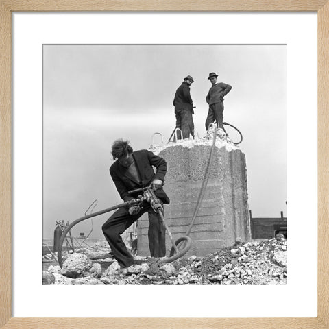 Three men working on a building site.