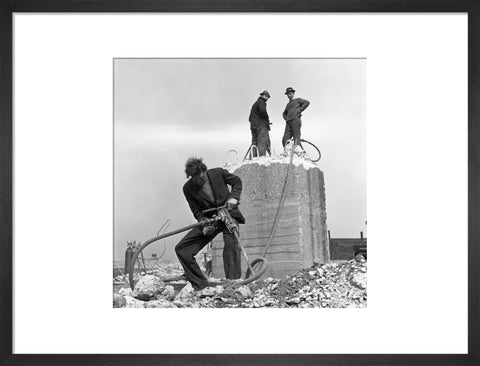 Three men working on a building site.