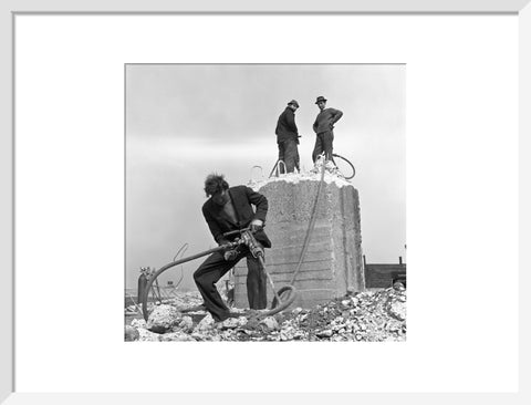 Three men working on a building site.