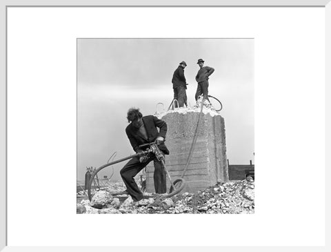 Three men working on a building site.