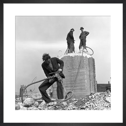 Three men working on a building site.