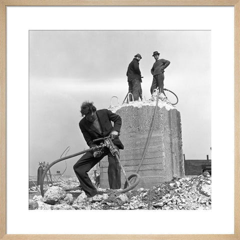 Three men working on a building site.