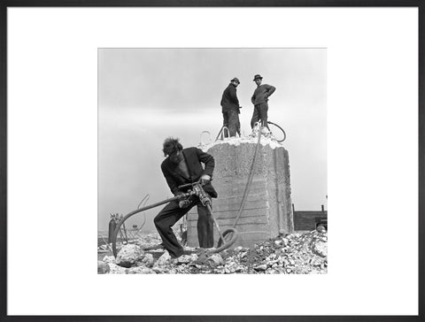 Three men working on a building site.