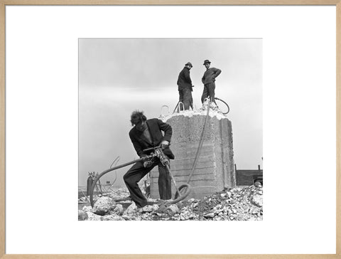 Three men working on a building site.