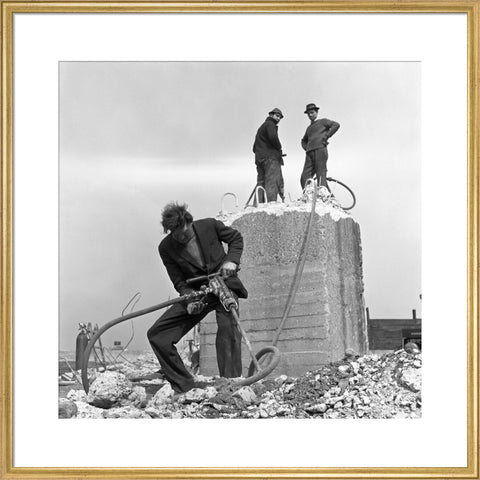 Three men working on a building site.