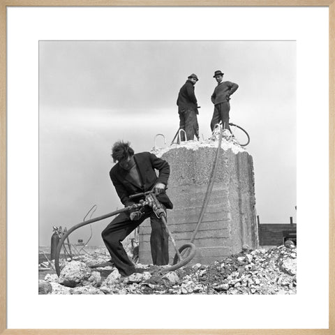 Three men working on a building site.