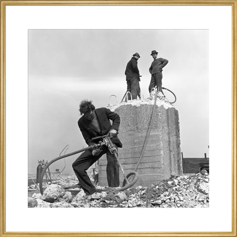 Three men working on a building site.
