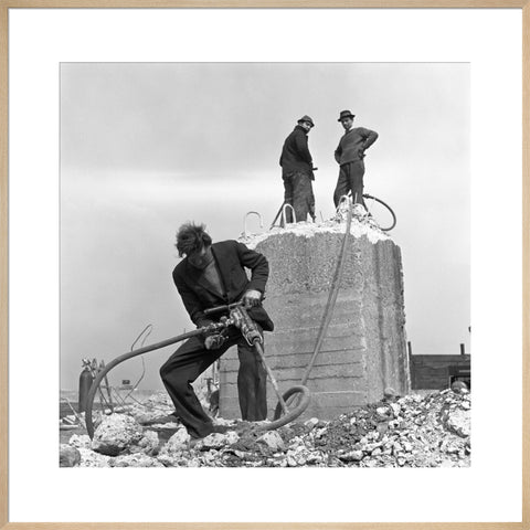 Three men working on a building site.
