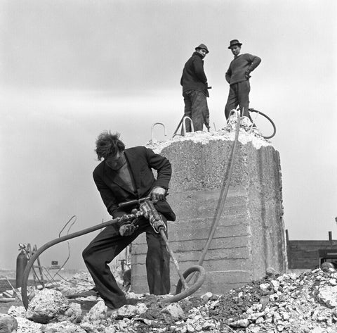 Three men working on a building site.