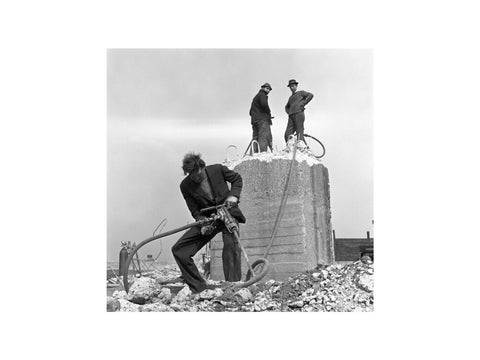 Three men working on a building site.