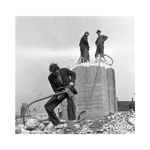 Three men working on a building site.