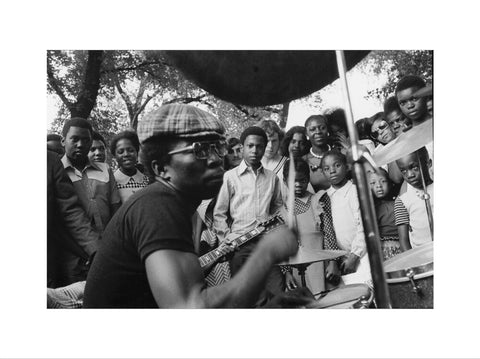 Band playing music to crowd at fun fair, Brent Cross 1973