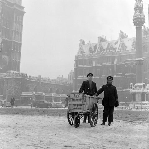 Newspaper sellers in the snow in Westminster