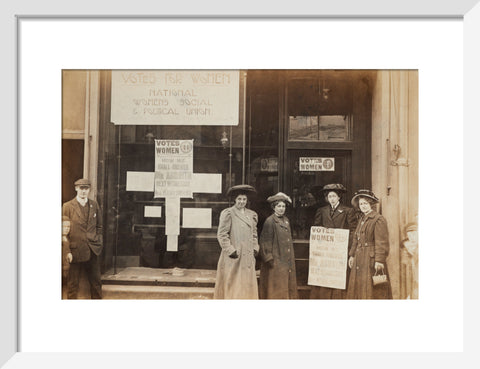 Photographic postcard of leading Suffragettes standing outside a branch shop of the Women's Social and Political Union in Hawick Scotland.