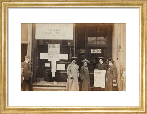 Photographic postcard of leading Suffragettes standing outside a branch shop of the Women's Social and Political Union in Hawick Scotland.