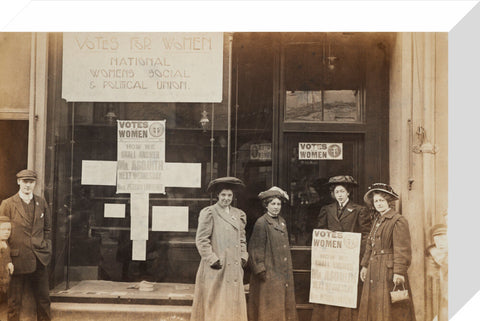 Photographic postcard of leading Suffragettes standing outside a branch shop of the Women's Social and Political Union in Hawick Scotland.