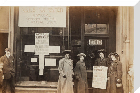 Photographic postcard of leading Suffragettes standing outside a branch shop of the Women's Social and Political Union in Hawick Scotland.