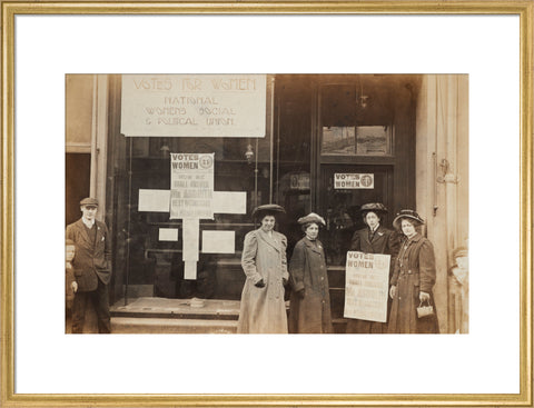 Photographic postcard of leading Suffragettes standing outside a branch shop of the Women's Social and Political Union in Hawick Scotland.