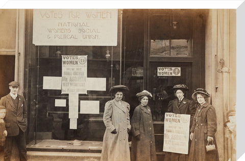 Photographic postcard of leading Suffragettes standing outside a branch shop of the Women's Social and Political Union in Hawick Scotland.