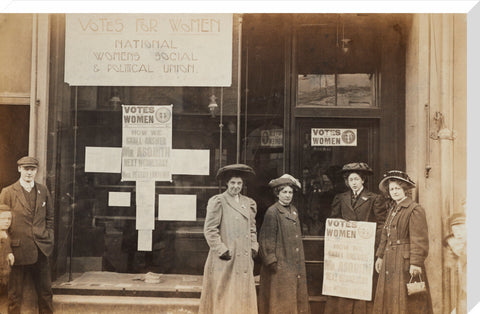 Photographic postcard of leading Suffragettes standing outside a branch shop of the Women's Social and Political Union in Hawick Scotland.