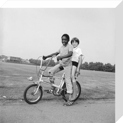 Two boys riding a bicycle 1973