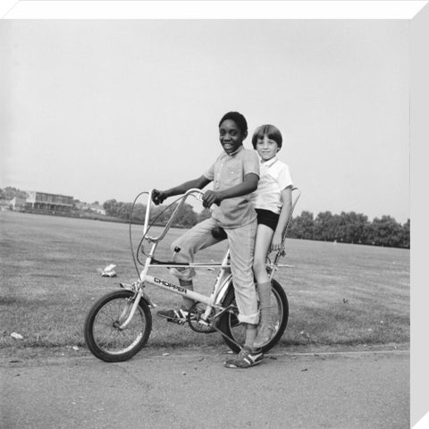 Two boys riding a bicycle 1973