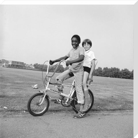 Two boys riding a bicycle 1973