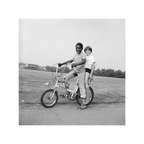 Two boys riding a bicycle 1973