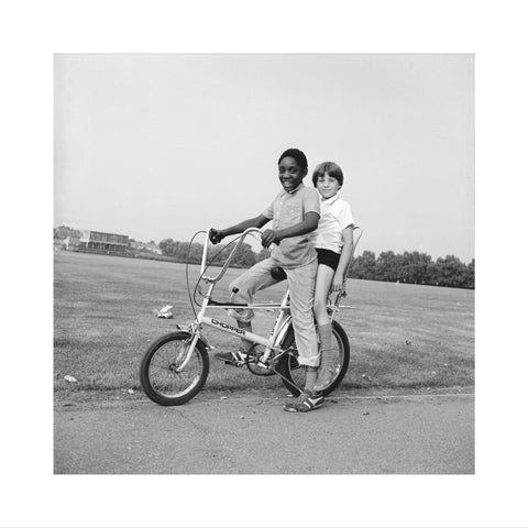 Two boys riding a bicycle 1973