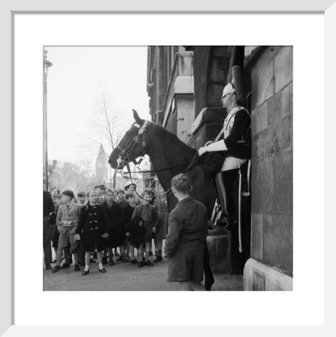 Children watch the horse guards 1960