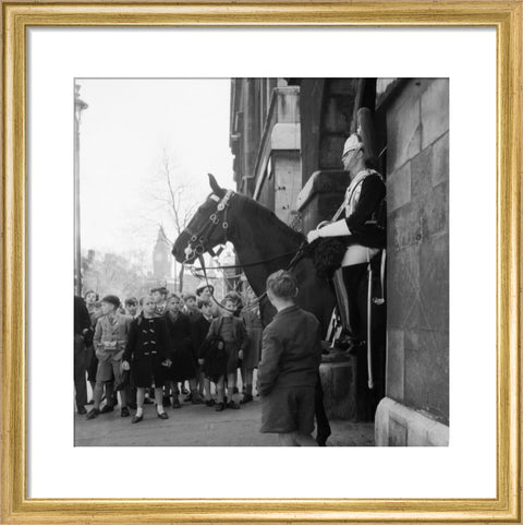 Children watch the horse guards 1960