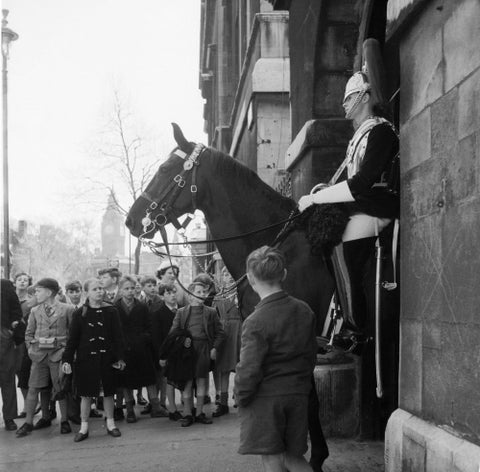 Children watch the horse guards 1960