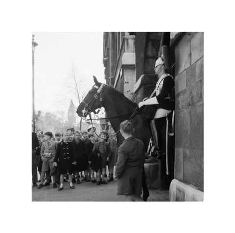 Children watch the horse guards 1960